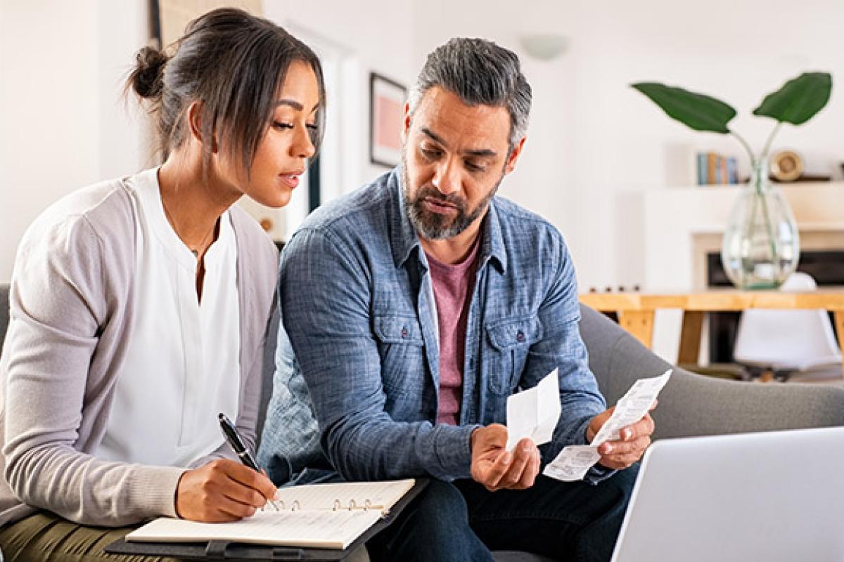 People reviewing finances on laptop