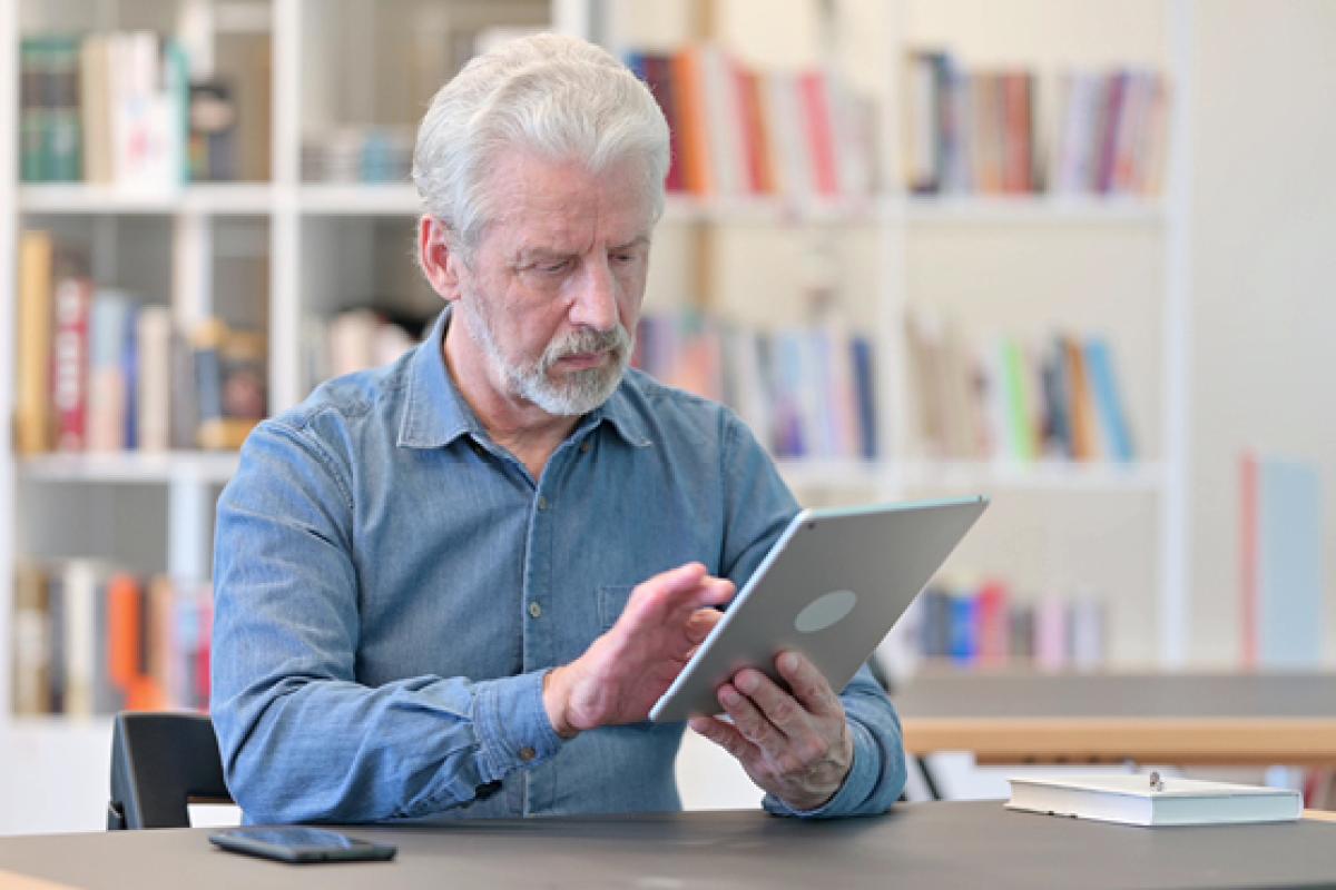 Elderly man using a tablet