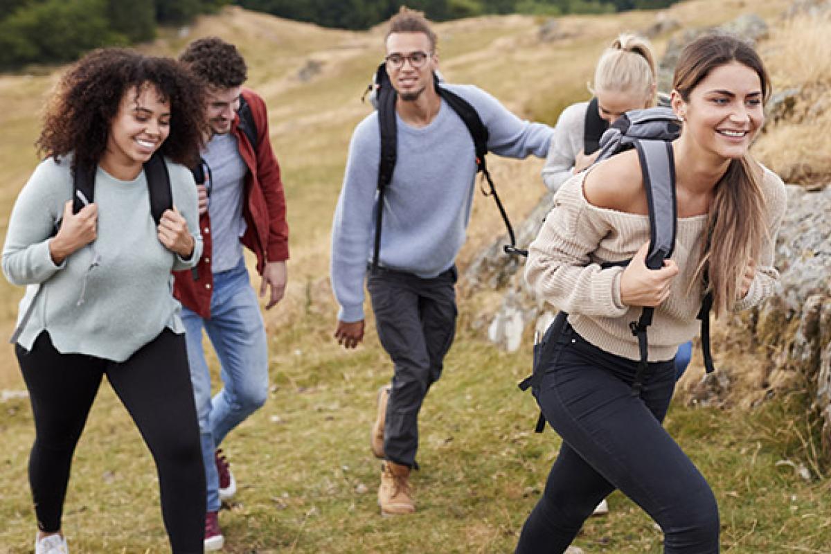 Group of young people walking in the countryside