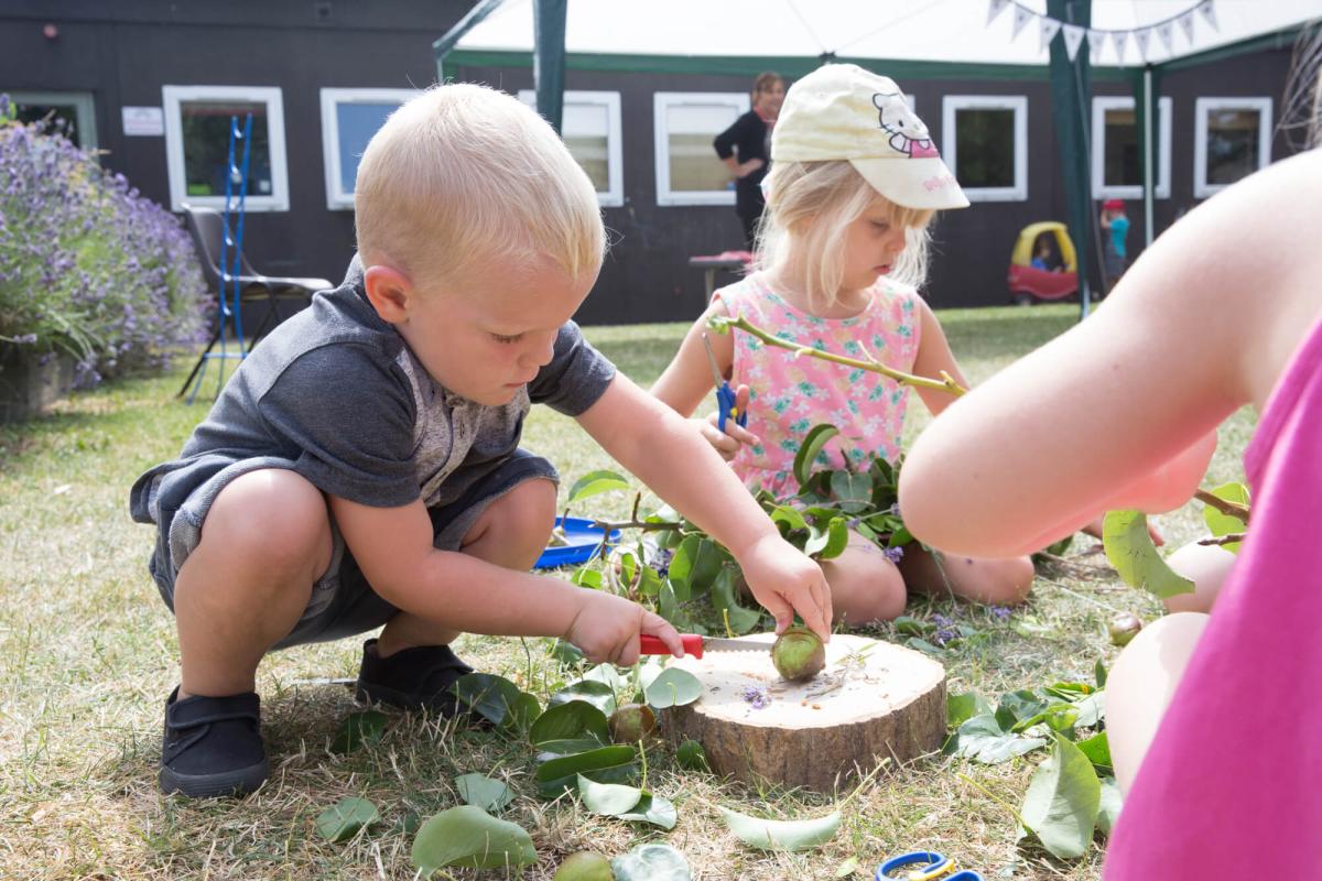 Young children playing in the garden