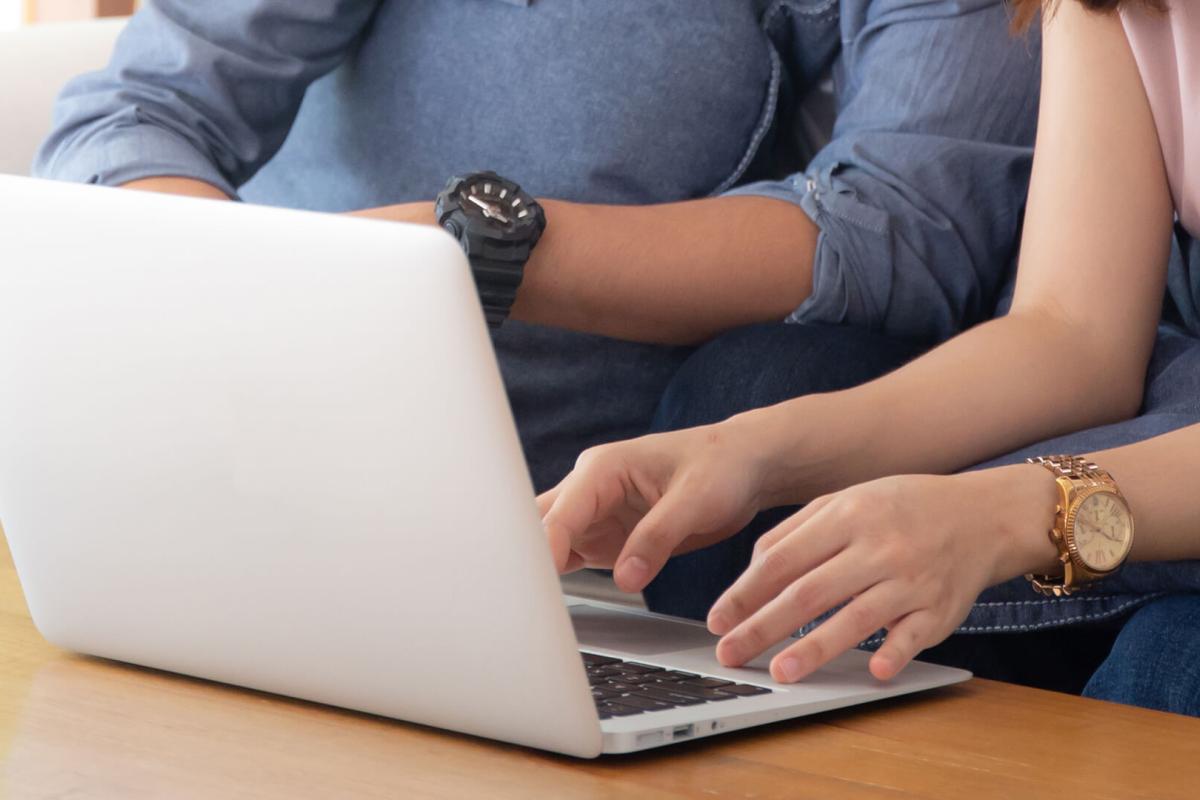 Young people using a laptop computer