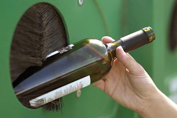 A glass bottle being recycled