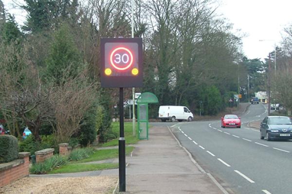 A flashing speed limit sign